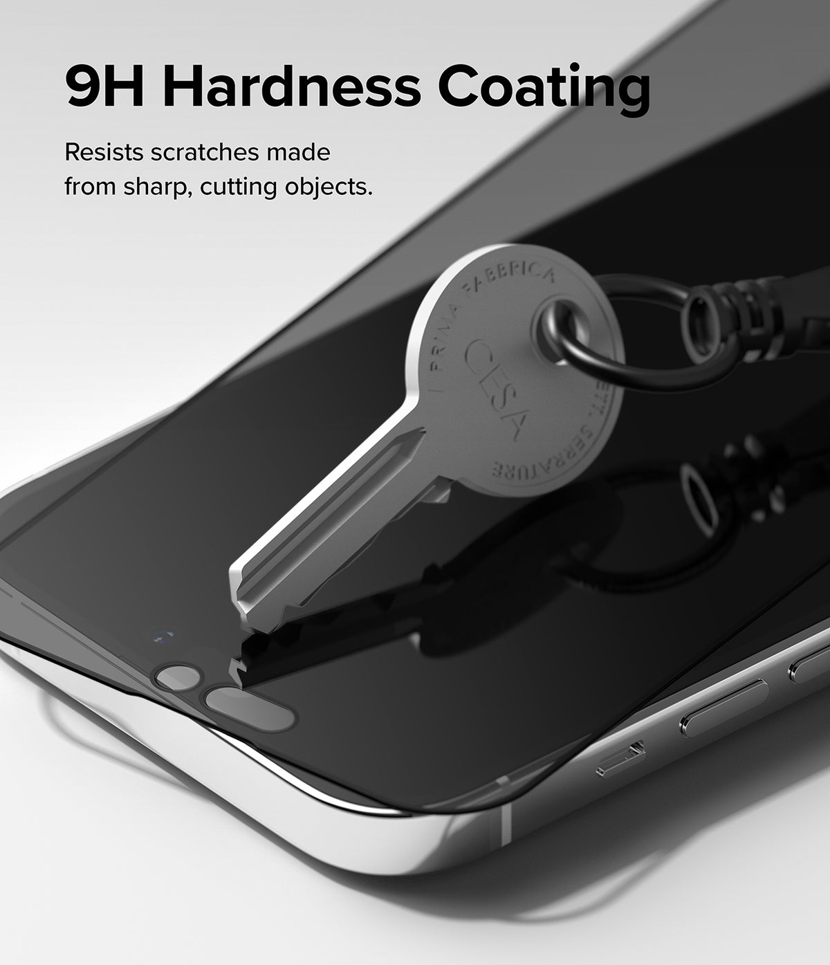 iPhone 14 Pro Max Screen Protector | Privacy Glass - iPhone 14 Pro Max Screen Protector - A metal key pressing against a smartphone screen protector to demonstrate scratch resistance.