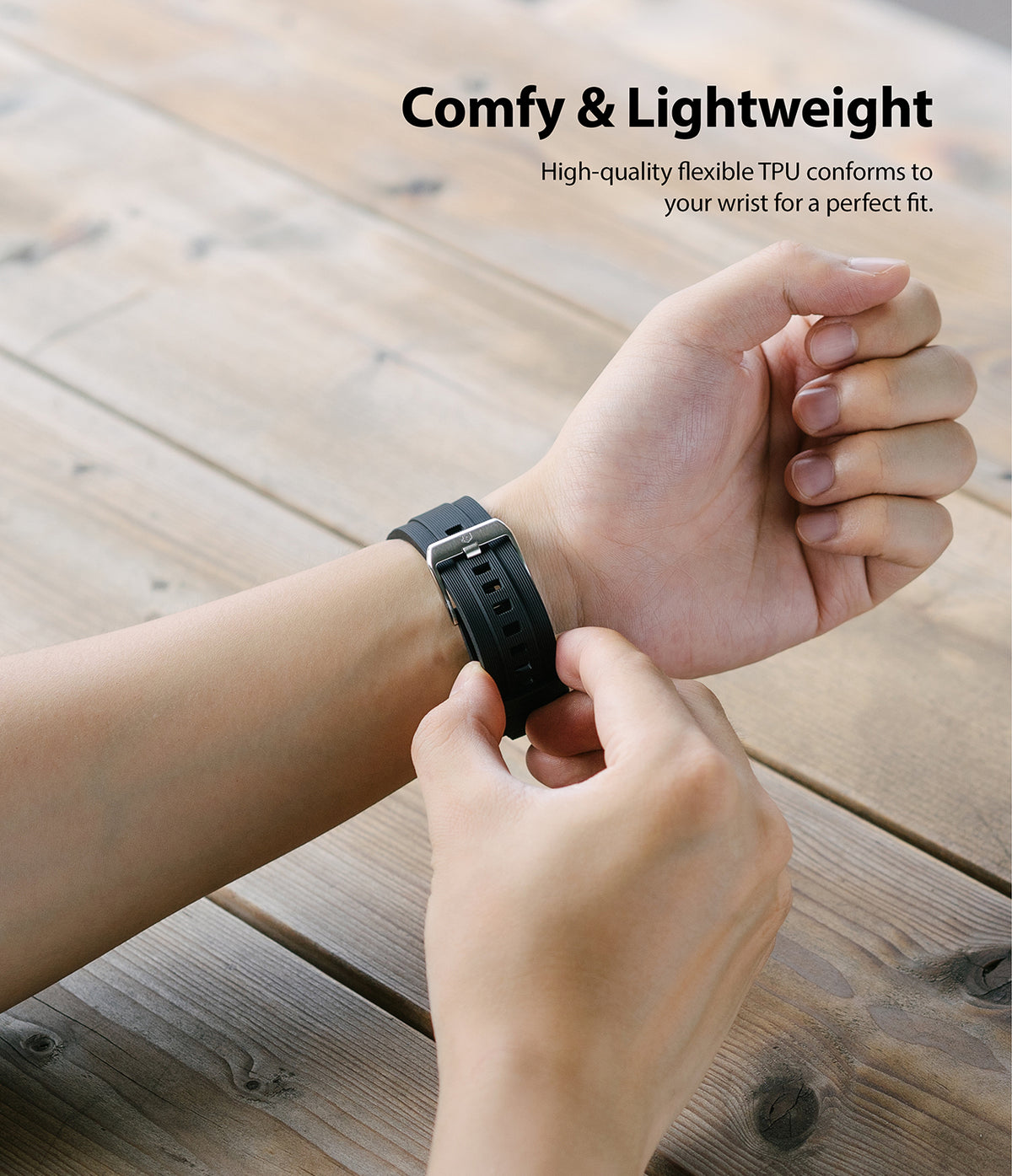 Watch Lug 22mm | Rubber One Band - Person fastening a black ribbed rubber watch strap on their wrist.