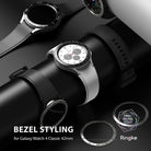 Galaxy Watch 4 Classic 42mm | Bezel Styling - Silver Galaxy Watch 4 with black bezel accessory on a display stand.