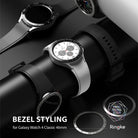 Galaxy Watch 4 Classic 46mm | Bezel Styling - Galaxy Watch 4 Classic 46mm - Three smartwatches with different metallic bezel styling rings on a black display stand.