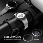 Galaxy Watch 4 Classic 42mm | Bezel Styling - Silver smartwatch with a tachymeter bezel ring and black silicone strap.