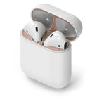 Ringke Airpods 2 / 1 Dust Guard Sticker - Open white charging case with rose gold metallic dust guard stickers applied.