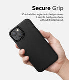iPhone 14 Case | Onyx - A hand holding a black textured iPhone 14 case with text about secure grip and ergonomic design.