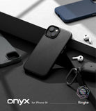 iPhone 14 Case | Onyx - Matte black textured iPhone 14 case on a dark surface with wireless earbuds and a charging case.