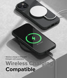 iPhone 14 Case | Onyx - Black iPhone 14 in an Onyx case charging wirelessly with a MagSafe puck and a wireless charging pad.