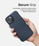 iPhone 14 Plus Case | Onyx - A hand holding a navy blue textured phone case with a dual-camera cutout against a white background.