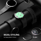 Galaxy Watch 5/4 40mm | Bezel Styling - Black smartwatch with a green floral watch face and a metallic numbered bezel accessory.