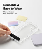 Holder Link & Snap Hook Lanyard Strap - Hand placing a black adhesive lanyard tab onto a clear phone case with others nearby.