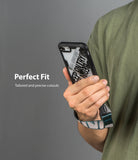 iPhone SE 2022 5G / SE 2020 / 8 Case | Fusion-X Design - Hand holding phone in a rugged case with a patterned wrist strap.