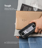 iPhone SE 2022 5G / SE 2020 / 8 Case | Fusion-X Design - Person holding a rugged black phone case with white text.