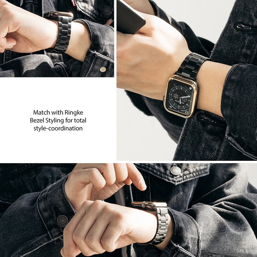 Apple Watch 49·46·45·44·42 mm | Metal One Band - Person wearing a black metal link watch band with a gold bezel.