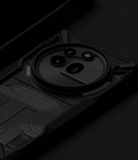 Nothing Phone (3a) Pro Case | Fusion-X - A black, rugged protective case featuring a circular camera cutout and textured circuit-like patterns.