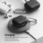 AirPods 3 Case | Onyx - Black textured AirPods case with a silver carabiner charging wirelessly on a grey pad.