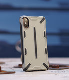 iPhone XS Case | Dual-X [DX] - Gray and black rugged protective phone case with a geometric design standing on a metal surface.