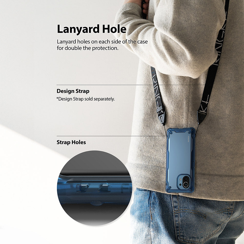 Mi 11 Case | Fusion-X - A person wearing a phone case with a lanyard attached, highlighting the dual strap holes.