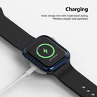 Apple Watch Series 6 / 5 / 4 / SE (40mm) | Bezel Styling - Apple Watch with blue bezel styling charging on a wireless pad.