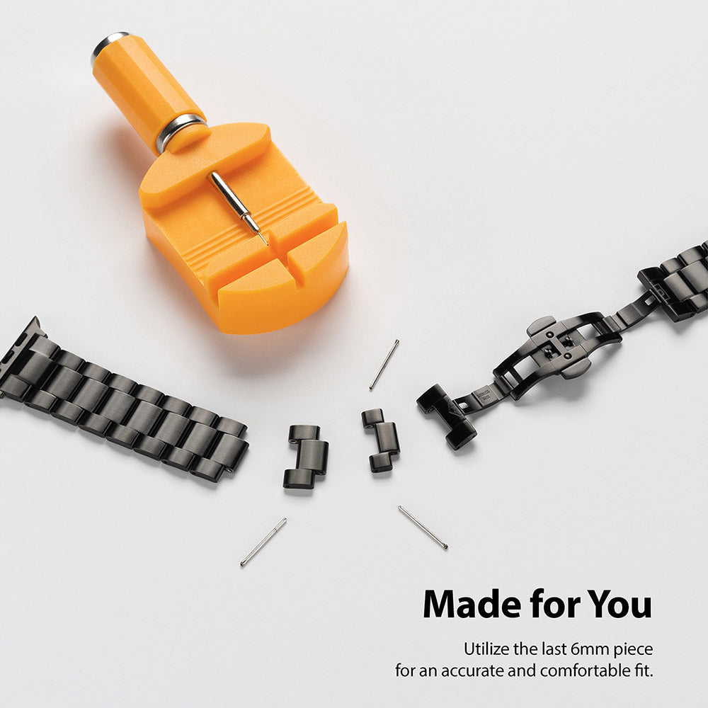 Apple Watch 49·46·45·44·42 mm | Metal One Band - A black metal watch band being resized with an orange link removal tool.