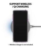 Galaxy S9 Case | Fusion - Smoke Black - Smartphone in a smoke black case resting on a circular wireless charging pad.