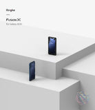 Galaxy M30 Case | Fusion-X - Two Samsung Galaxy M30 phones in black and blue Fusion-X protective cases on white geometric platforms.