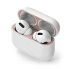 Ringke Airpods Pro Dust Guard Sticker - Open white charging case with rose gold metal dust guard and white earbuds.