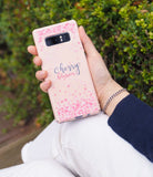 Galaxy Note 8 [Slim Cherry Blossom] [Limited Edition] - Hand holding a pink phone case with cherry blossom petal patterns.