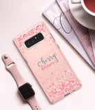 Galaxy Note 8 [Slim Cherry Blossom] [Limited Edition] - Phone case with pink cherry blossom petals, next to a watch.