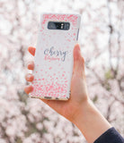 Galaxy Note 8 [Slim Cherry Blossom] [Limited Edition] - Hand holding a white phone case with pink petals and text.