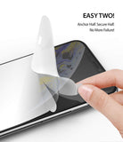 iPhone XS Screen Protector | Dual Easy Film - Hand applying a screen protector to an iPhone using a two-step method.
