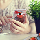 Galaxy S8 Plus Case | Mirror - Person holding a phone with a reflective case showing a chocolate cupcake with a strawberry.