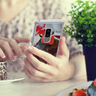 Galaxy S9 Plus Case | Mirror - Silver - Person holding a silver mirror-finish phone case reflecting a strawberry dessert.