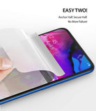 Galaxy A70 Screen Protector | Dual Easy Film - Galaxy A70 Screen Protector - Hand applying a clear protective film to a smartphone screen with text instructions above.