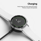 Galaxy Watch 4 Classic 46mm | Bezel Styling - Smartwatch with black bezel styling charging wirelessly at 75% battery.