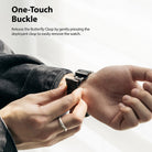 Apple Watch 49·46·45·44·42 mm | Metal One Band - Hands pressing the butterfly clasp on a black metal watch band.