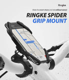 Spider Grip Bike Mount - Smartphone secured in a black silicone spider mount attached to white bicycle handlebars.