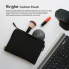 Cushion Pouch - Black zippered pouch with makeup brush, NARS compact, lipstick, computer mouse, and keyboard on white desk.