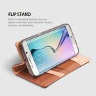 Galaxy S6 Edge [DISCOVER] - Brown - Samsung Galaxy S6 Edge in a brown leather flip wallet case propped up as a stand.