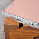Xperia Z5 Premium Case | Mirror - Rose Gold - Rose gold mirrored phone case with clear bumper resting on a wooden block.