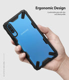 Galaxy A70 Case | Fusion-X - Hand holding a blue Samsung Galaxy A70 in a black, rugged Ringke Fusion-X protective case.