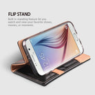 Galaxy S6 [DISCOVER] - Brown - A brown and black leather wallet case holding a Galaxy S6 in a horizontal flip stand position.