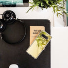 Galaxy Note 8 Case | Mirror - Reflective phone case on a desk with a notebook, headphones, and a plant.