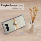 Galaxy Note 8 Case | Mirror - Reflective phone case next to a reed diffuser and small crystals on a wooden surface.