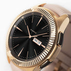 Galaxy Watch (42mm) | Bezel Styling - Rose gold fluted bezel ring on a black smartwatch with a light pink silicone band.