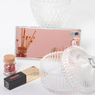 Xperia Z5 Premium Case | Mirror - Rose Gold - Rose gold mirror phone case reflecting dried flowers, beside a glass jar and lipstick.
