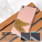 Xperia Z5 Premium Case | Mirror - Rose Gold - Rose gold mirror phone case with fern leaf design on a wooden surface.