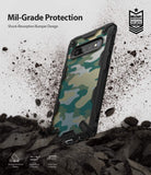Galaxy S10 Case | Fusion-X Design - Camouflage phone case with black shock-absorbent bumpers amidst flying debris.