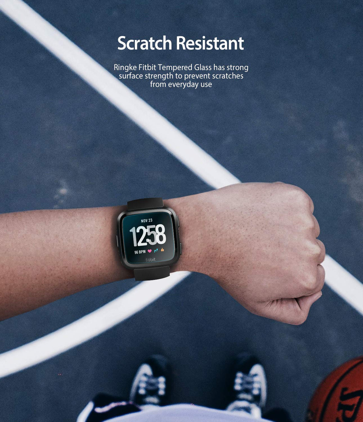 Fitbit Versa Screen Protector | Glass - Fitbit Versa Screen Protector - A person wearing a black Fitbit Versa on a basketball court with scratch-resistant text overlay.