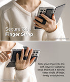 Galaxy S25 Ultra Cover | Folio Grip Wallet Magnetic - Galaxy S25 Ultra Cover - Person holding a phone with a black folio case featuring a secure polyester finger strap.