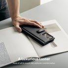 Galaxy Note 20 Ultra Case | Folio Signature+ - Hand resting on a black leather folio case for a Galaxy Note 20 Ultra.
