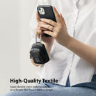 Mini Pouch | Block - Person holding a black smartphone with a small, durable black nylon pouch clipped to it via carabiner.