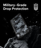 Galaxy A35 Case | Fusion-X - Camouflage phone case on a rock with debris, featuring Military-Grade Drop Protection text and badge.